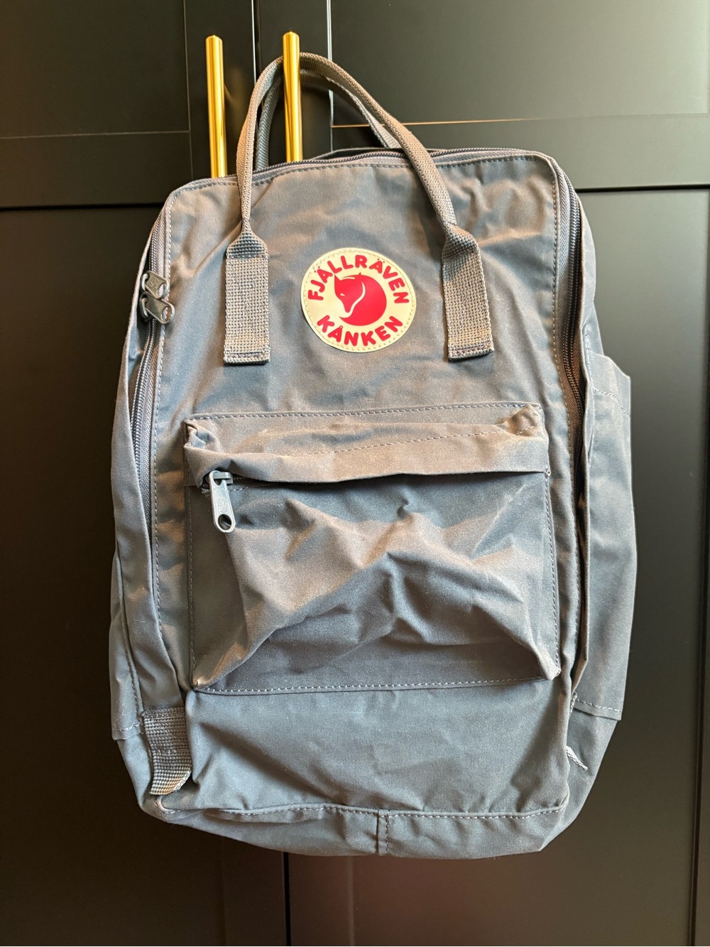 This grey Fjällräven Kånken 16L